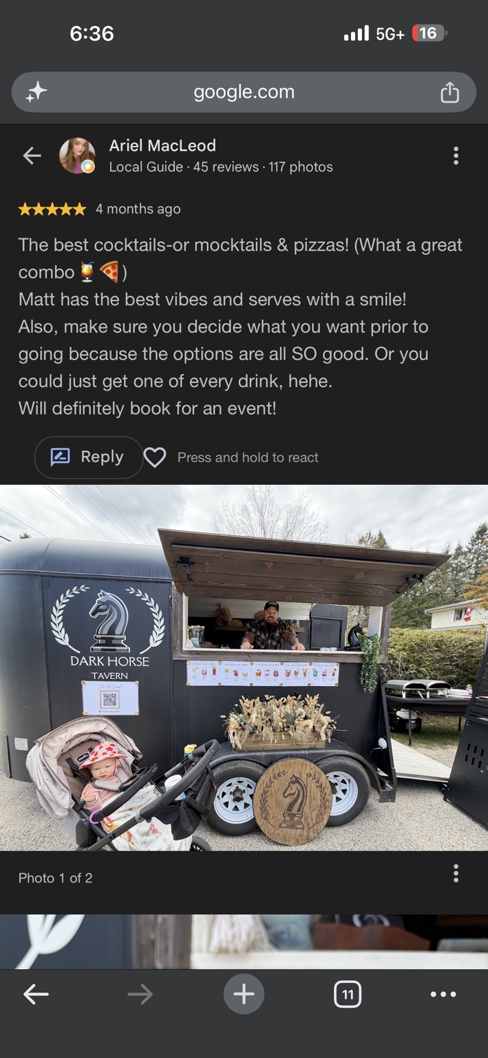 Dark Horse Tavern trailer with its horse logo, drink menu, and Matt at the serving window