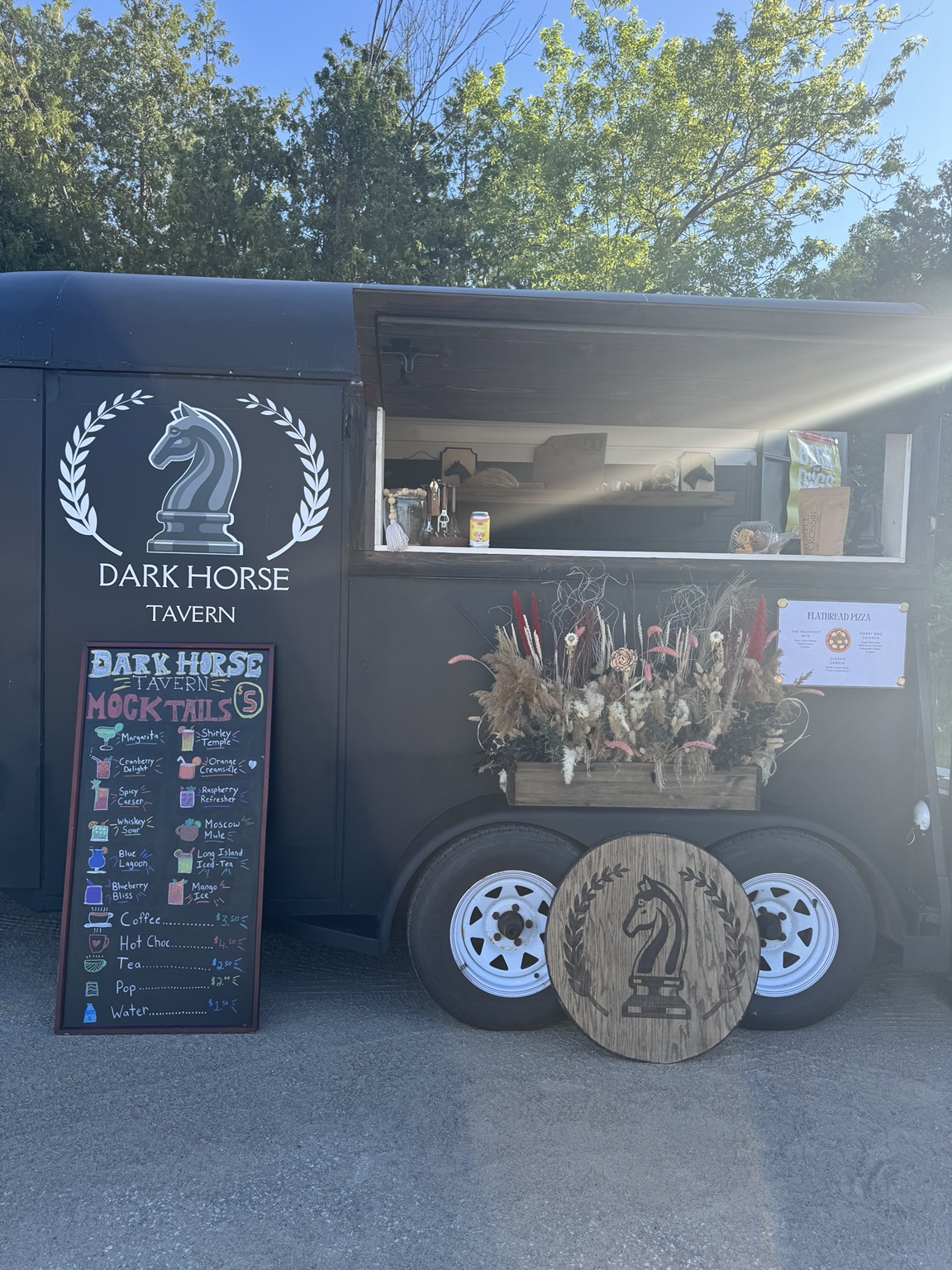 The Dark Horse Tavern trailer open and ready for service at an outdoor event
